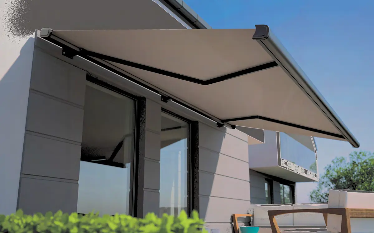 A motorised folding-arm awning reaching over a patio