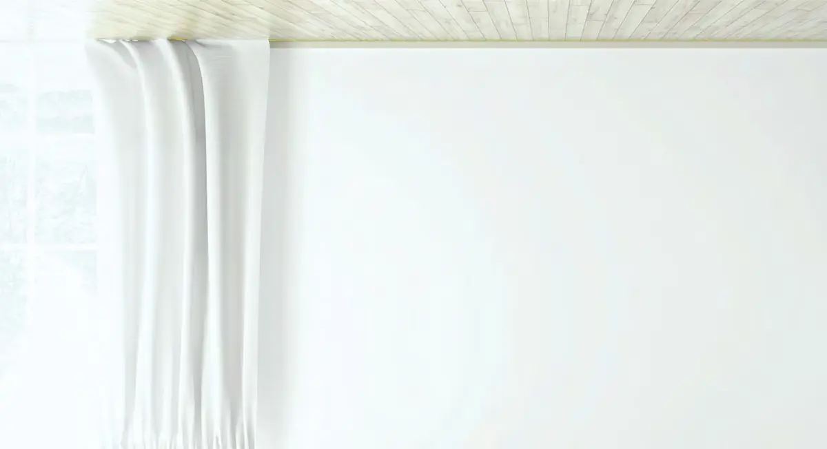 Sheer white curtains on a motorised track