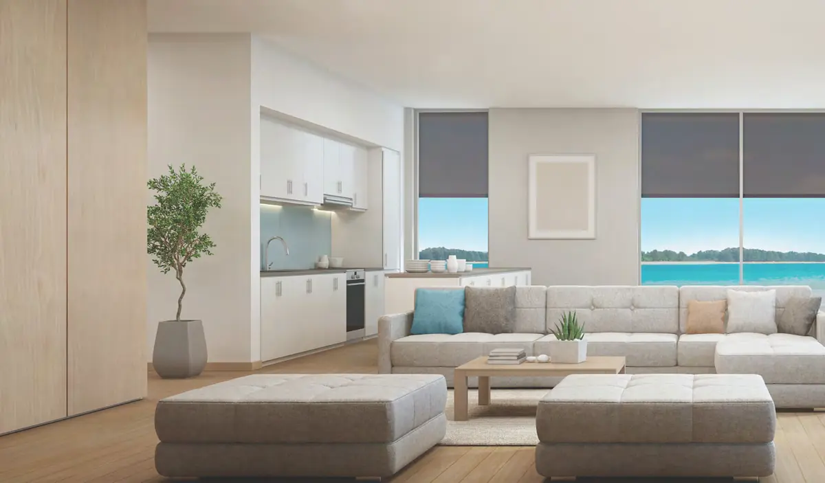 Grey roller blinds half drawn across a bright kitchen and living space